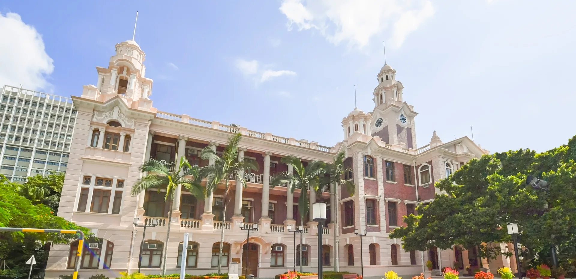 HKU Main Building beneath a blue sky